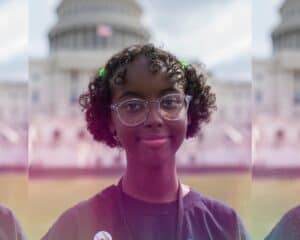 Isra HirsiII standing in front of white house